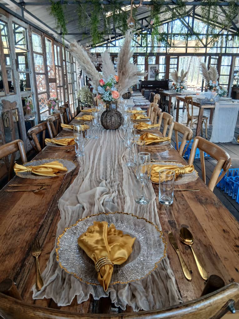Rustic gold-themed long table with elegant styling